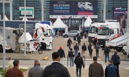 Entrance to the SOLUTRANS trade fair with trucks and visitors