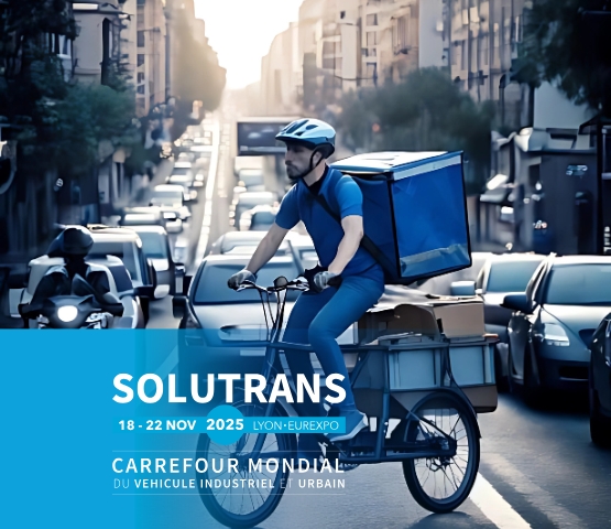Man on a cargo bike with French SOLUTRANS 2025 logo