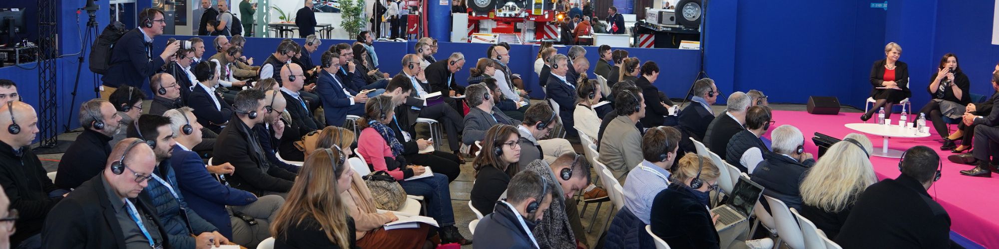 Group of people with headphones at SOLUTRANS edition 2023