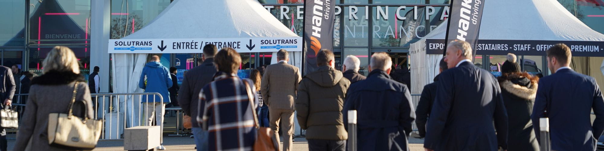 SLIDER entrance to SOLUTRANS with groups of people