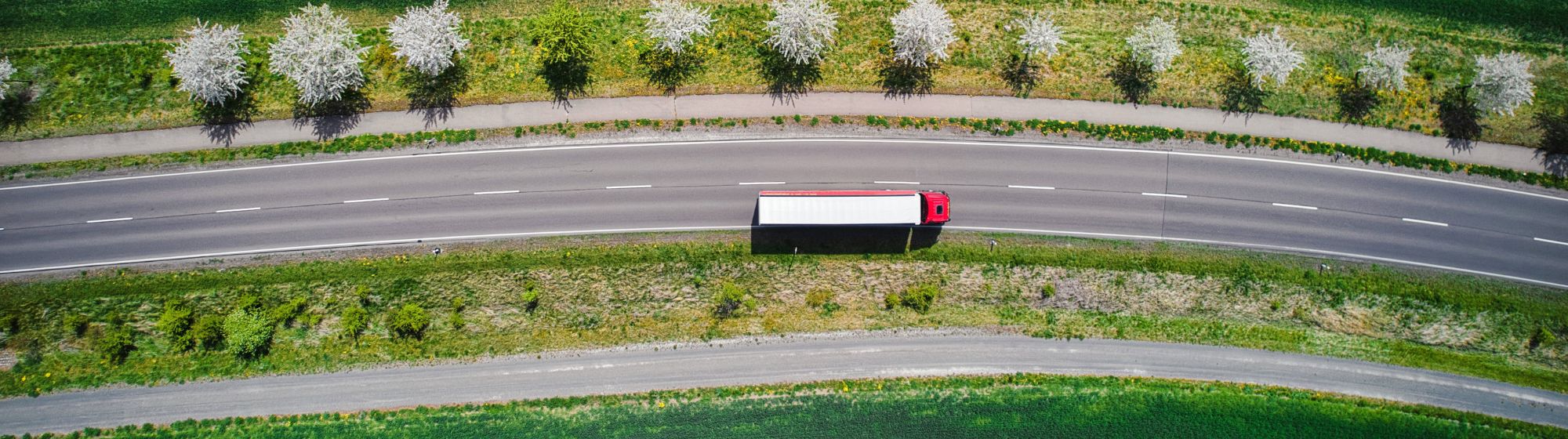 Photo of a truck on a road seen from above